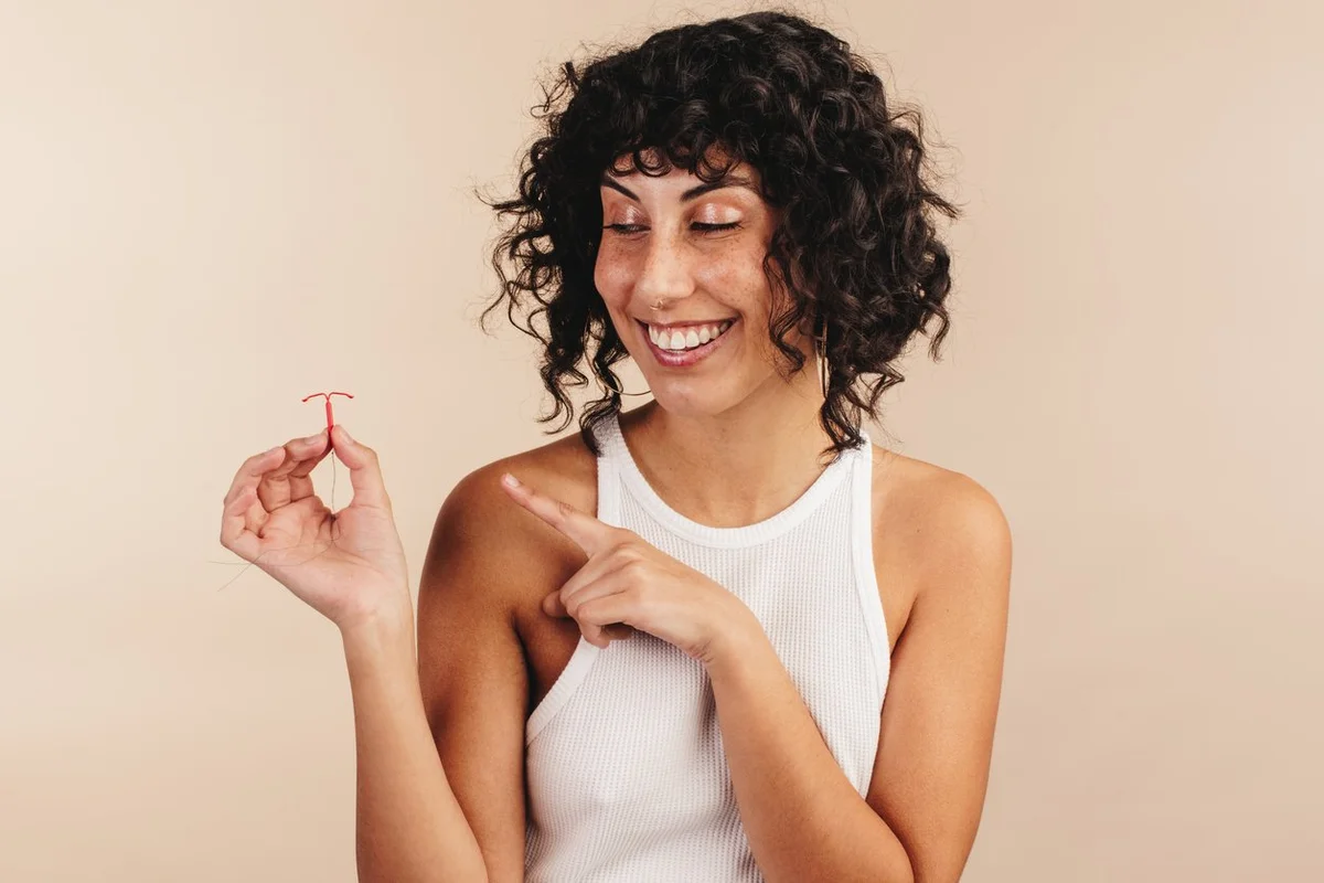 woman holding and IUD