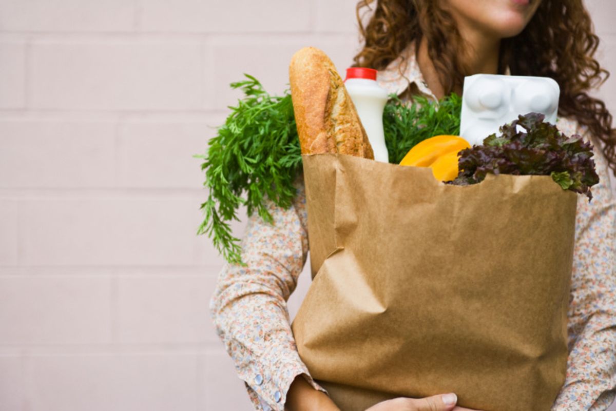 woman holding groceries