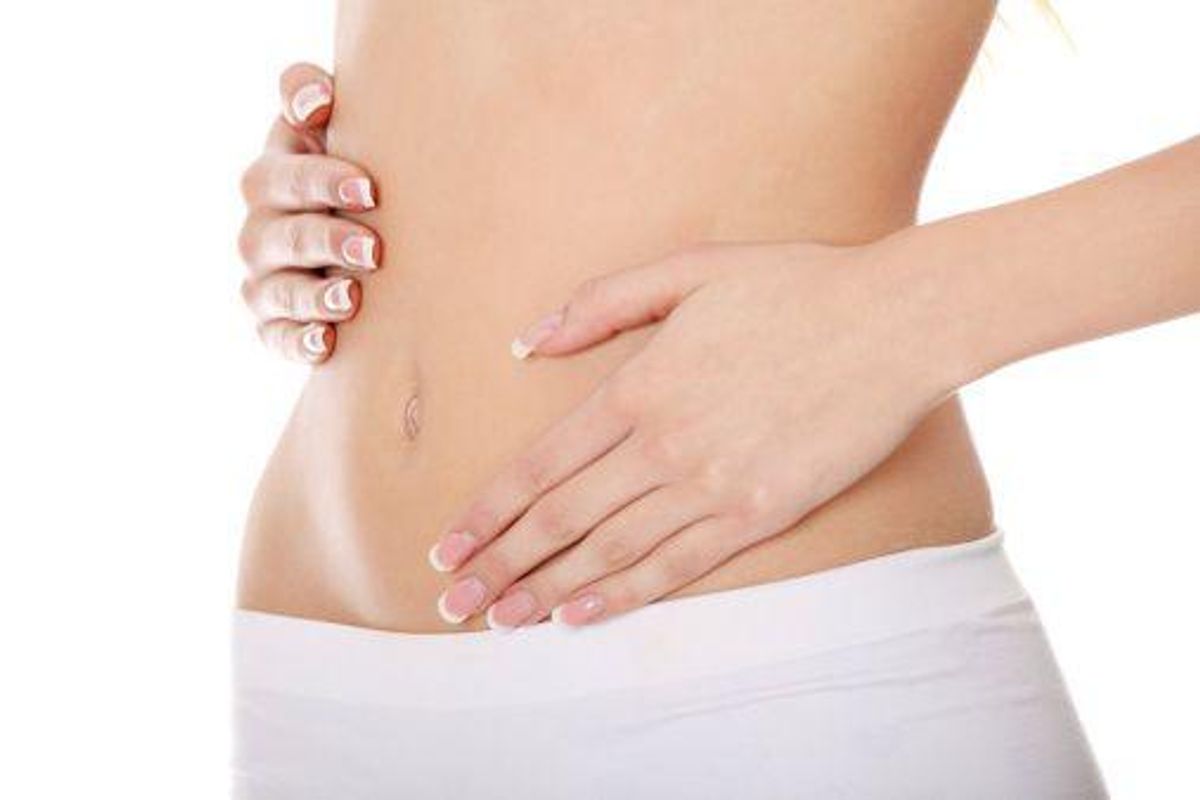 woman holding her stomach