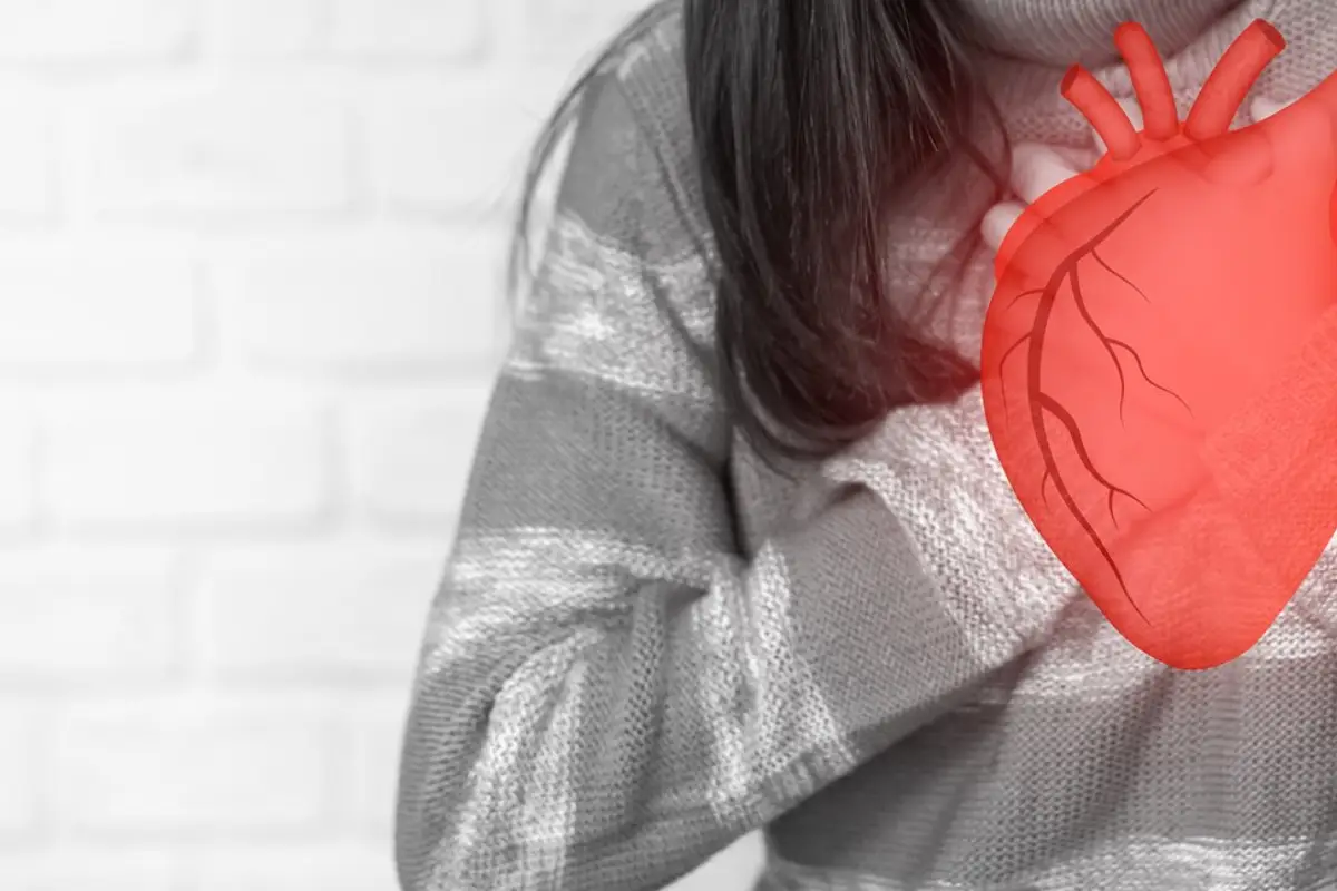 Woman holding red heart organs