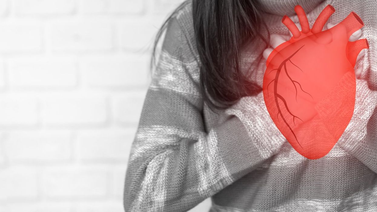Woman holding red heart organs