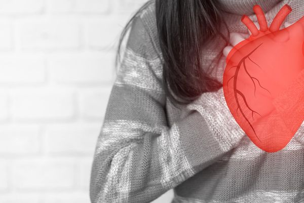 Woman holding red heart organs