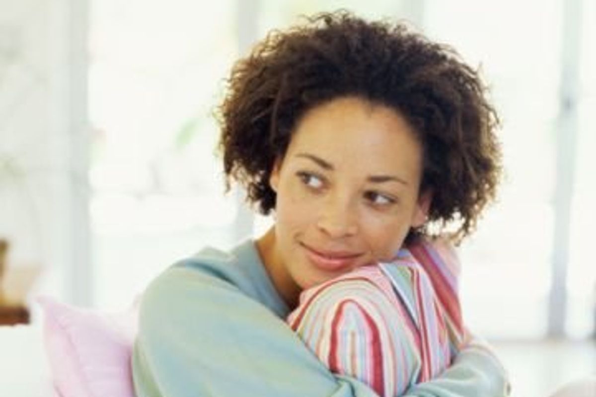 woman hugging a pillow