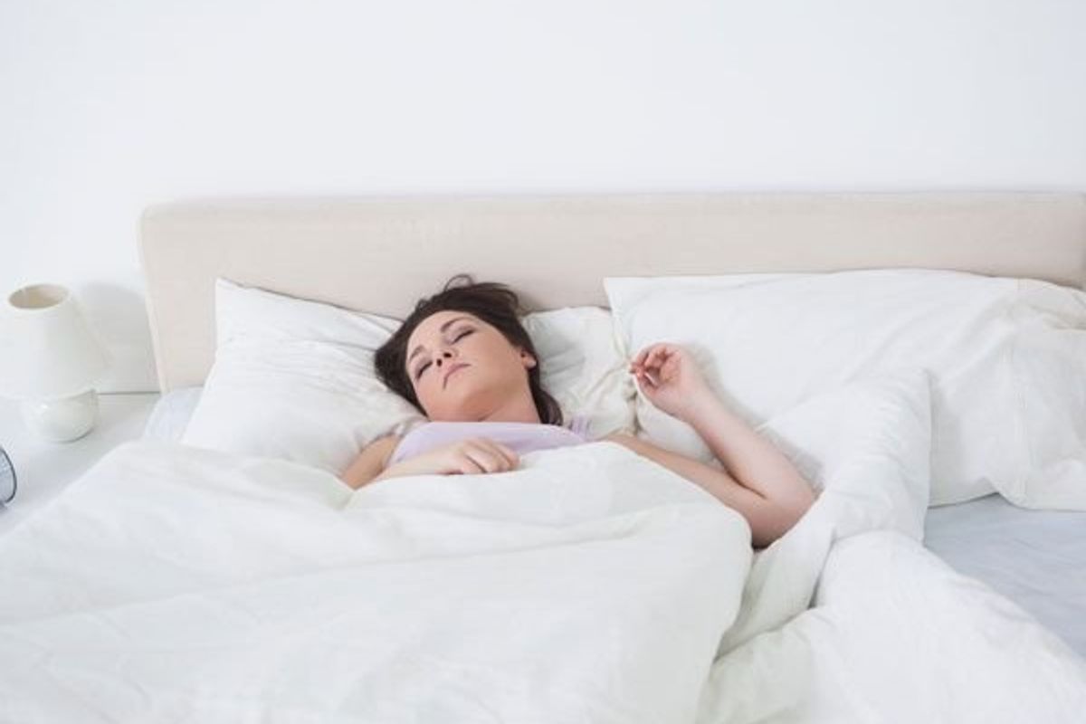 woman in a deep sleep in bed