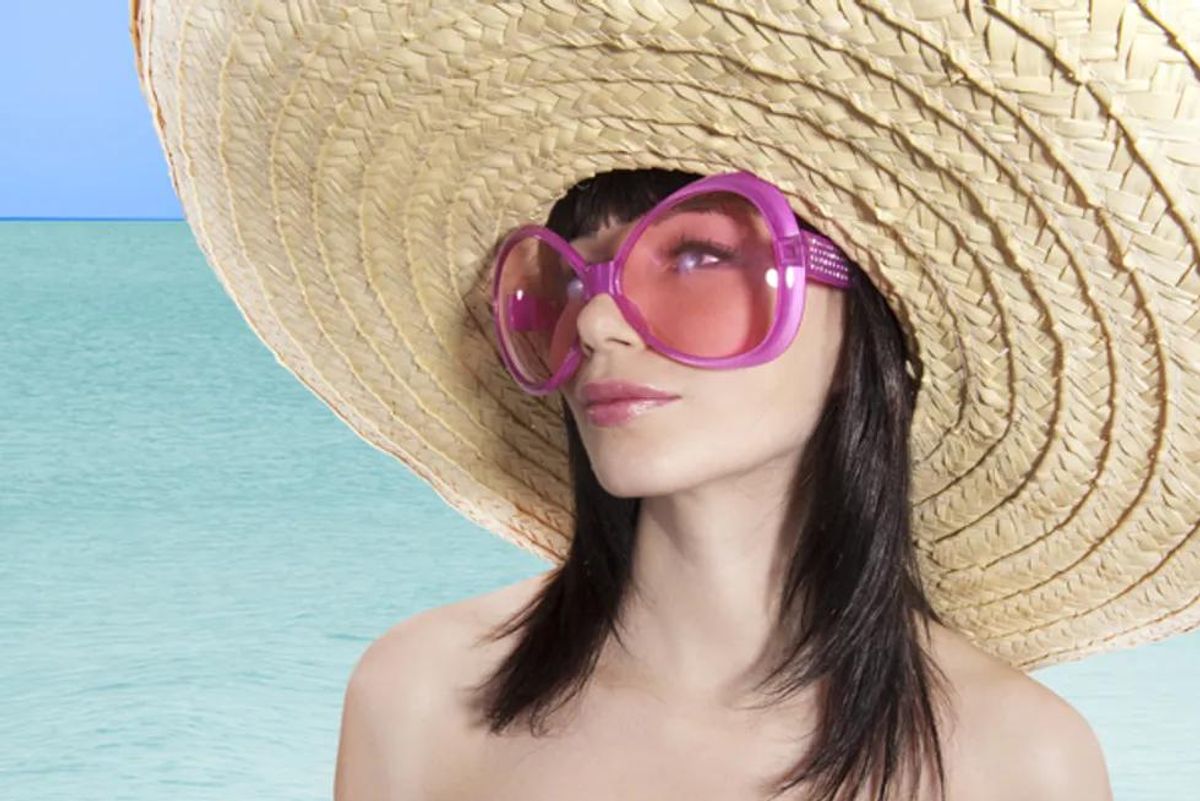 woman in a large sunhat and sunglasses