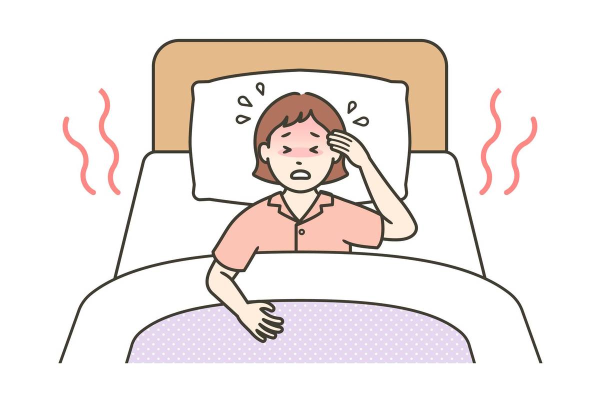 woman in bed having a hot flash