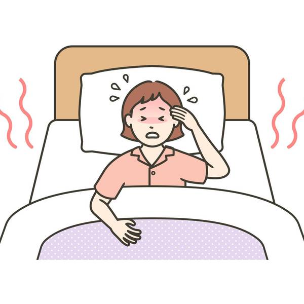 woman in bed having a hot flash