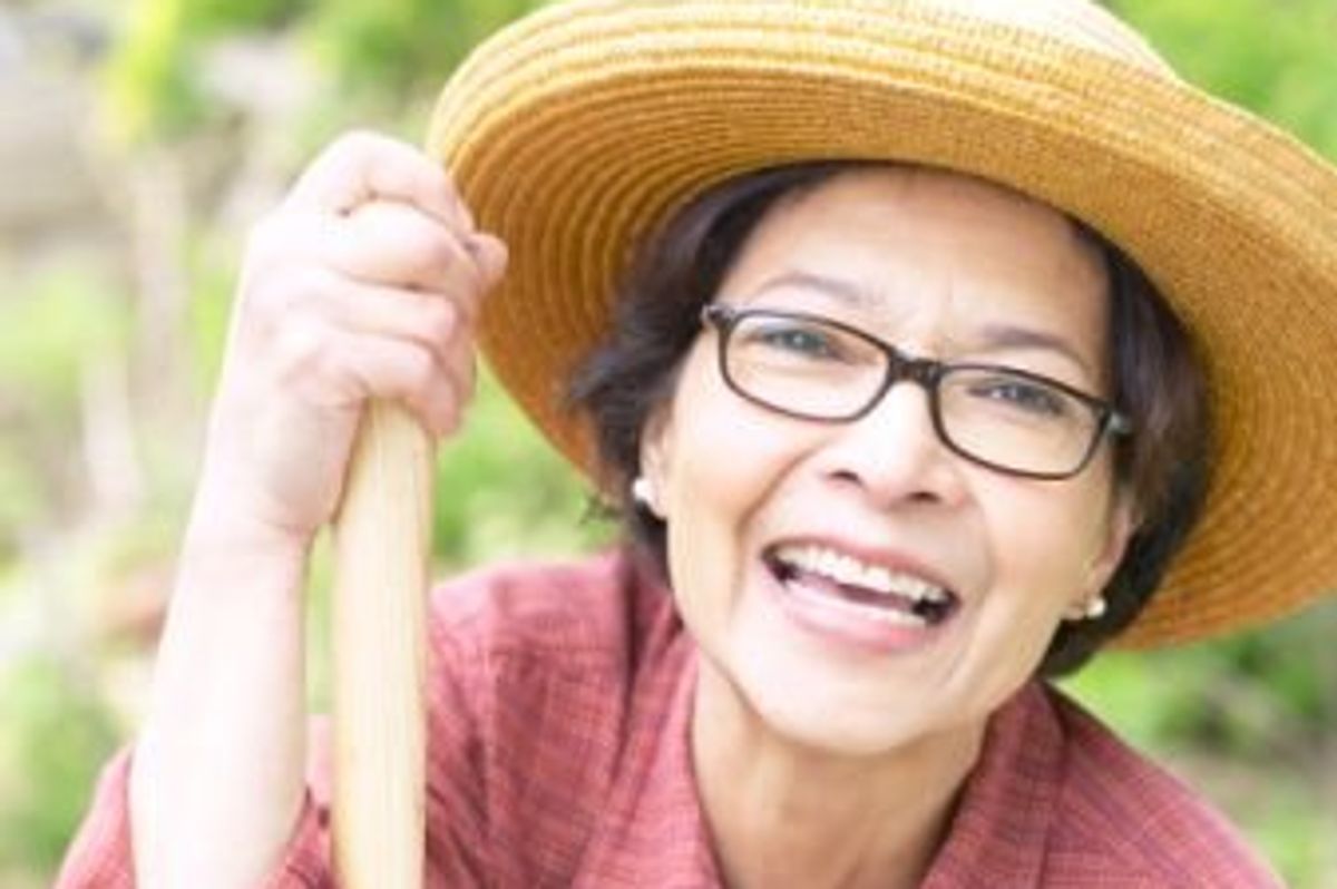 woman in her 60s gardeining