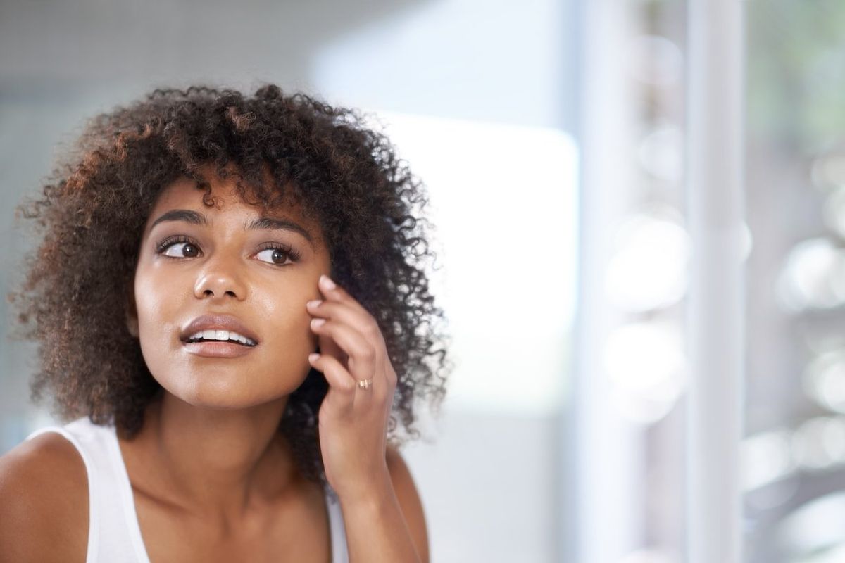 woman in her bathroom at home
