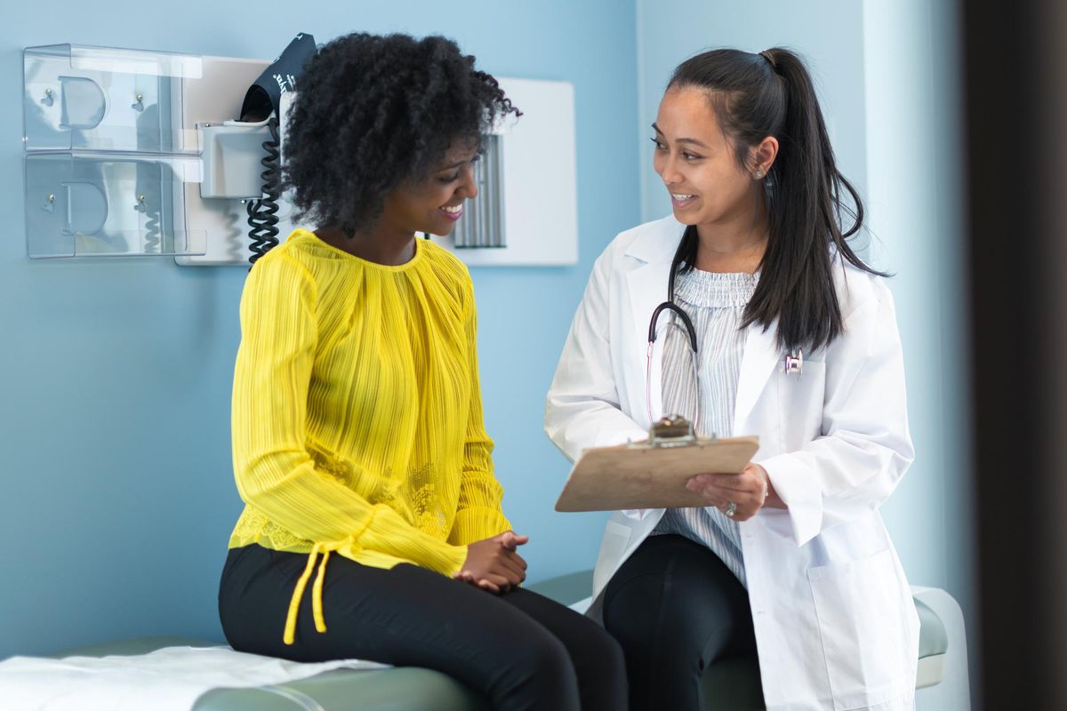 woman in medical consultation with female doctor