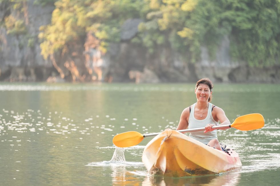 Woman Kayaking in Lan Ha Bay, Vietnam
