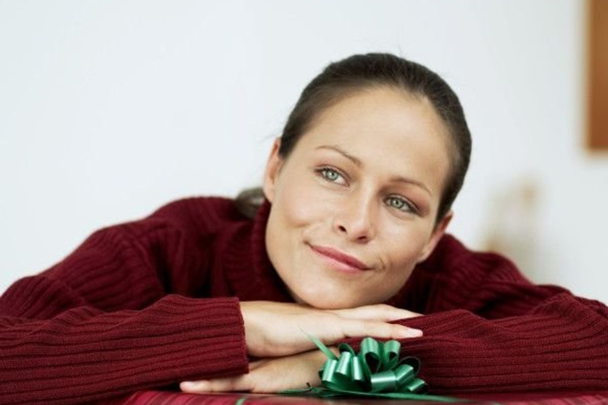 woman leaning on a gift