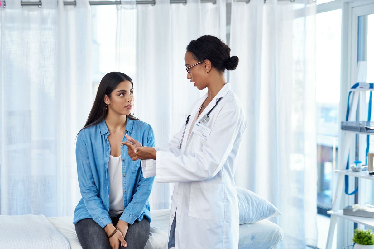 woman listening to her doctor