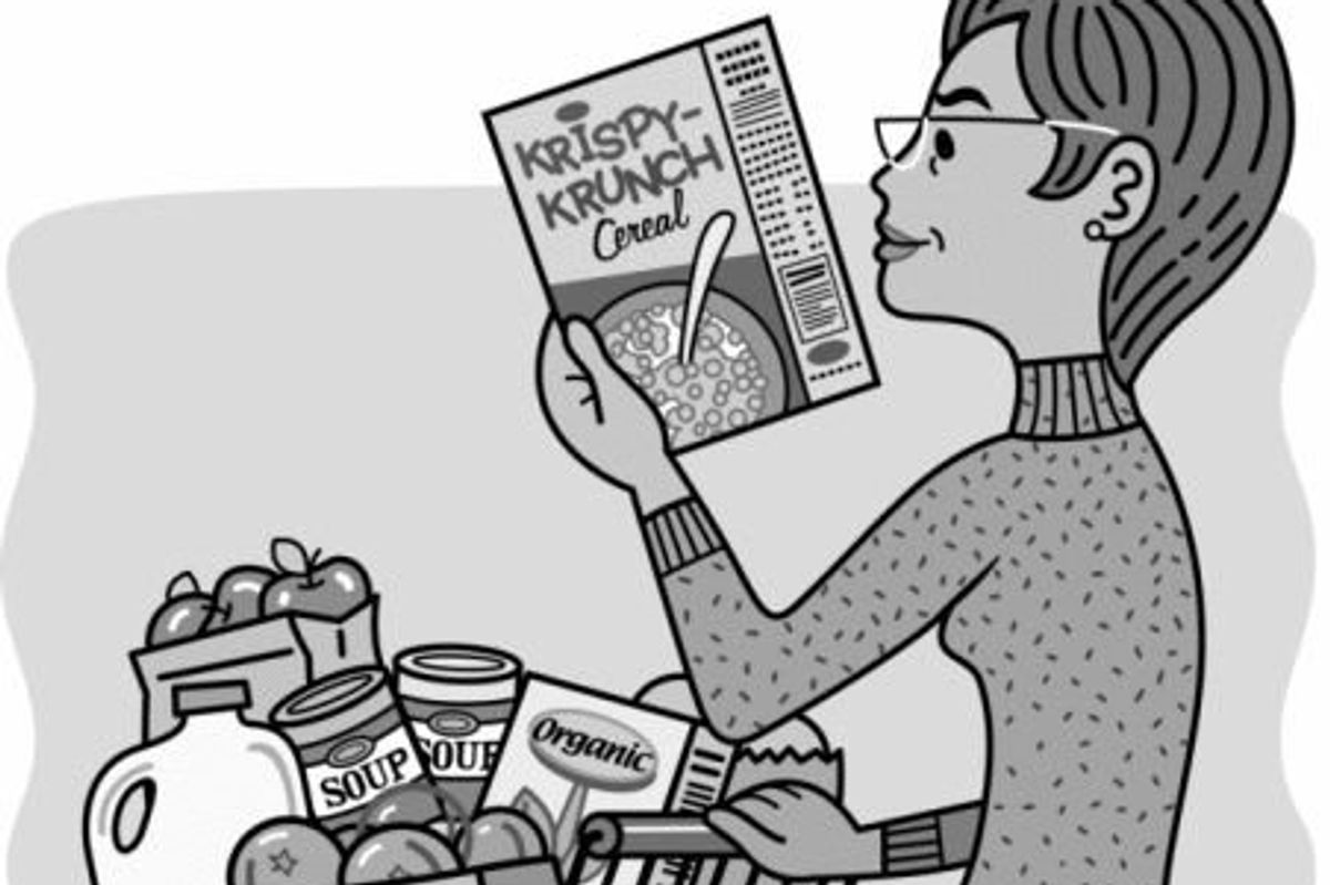 woman looking at a cereal nutrition label in the supermarket