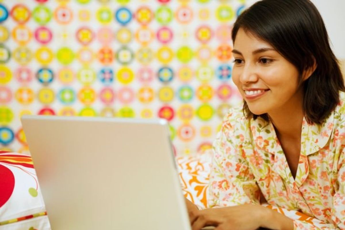 woman looking at a laptop