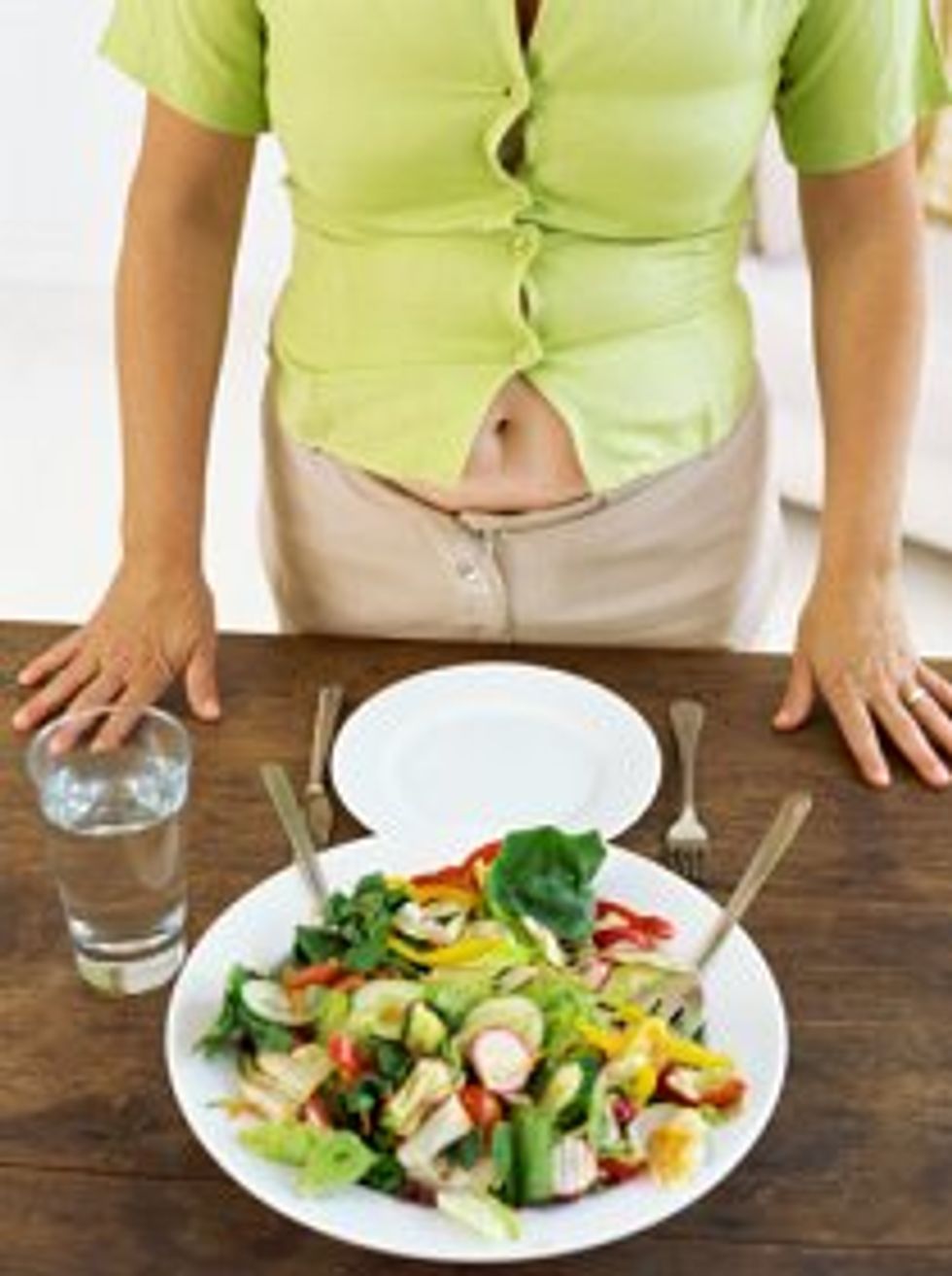 woman looking at a salad