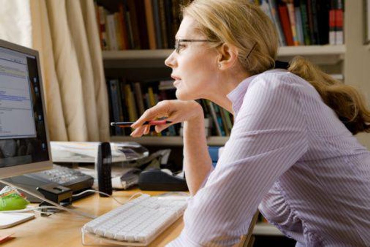 woman looking at computer screen