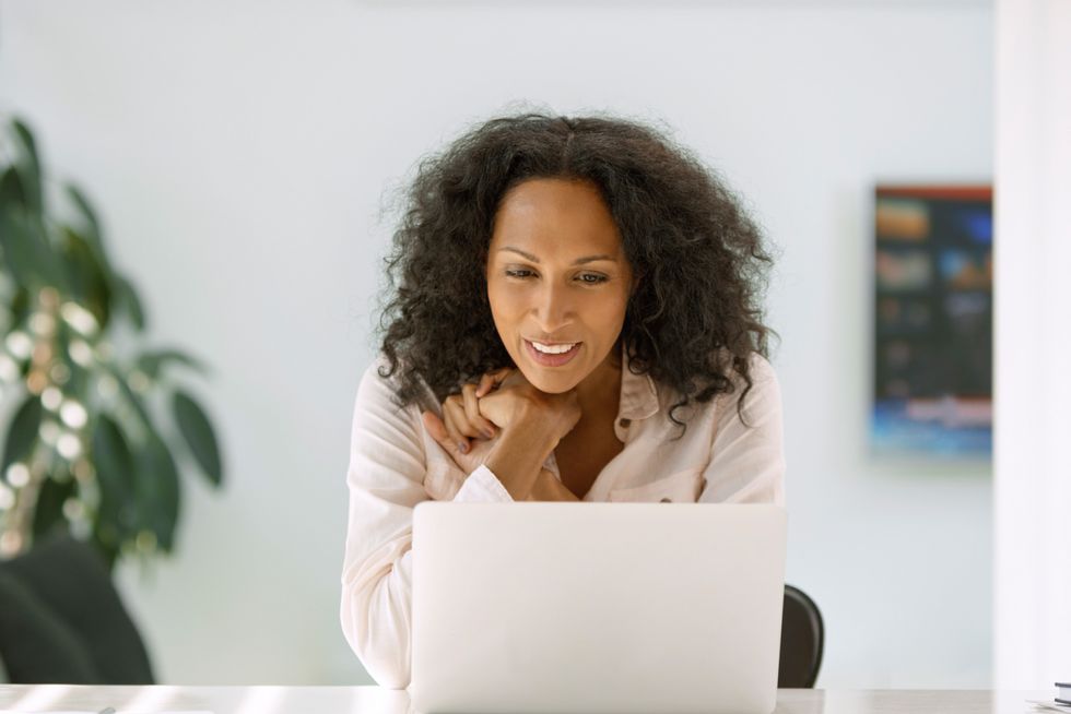 woman looking at her computer