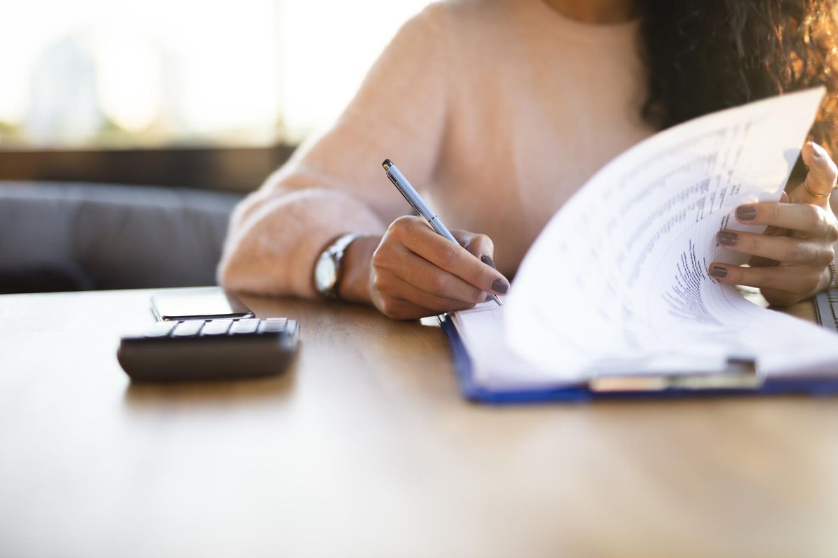 Woman looking at insurance forms