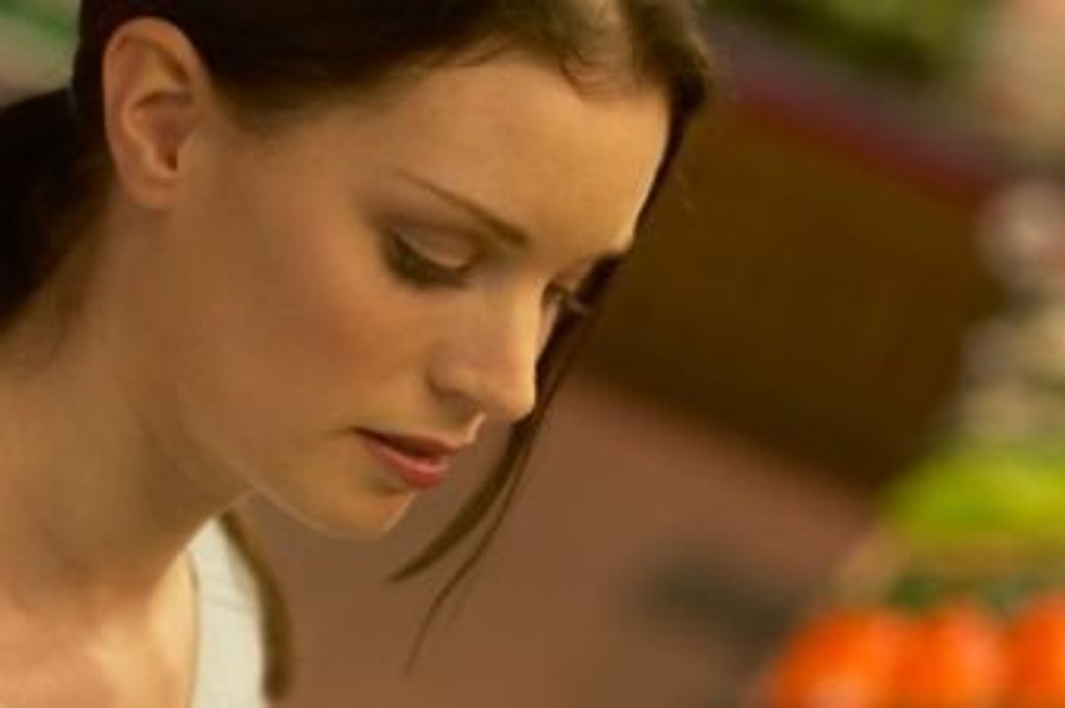 woman looking at produce