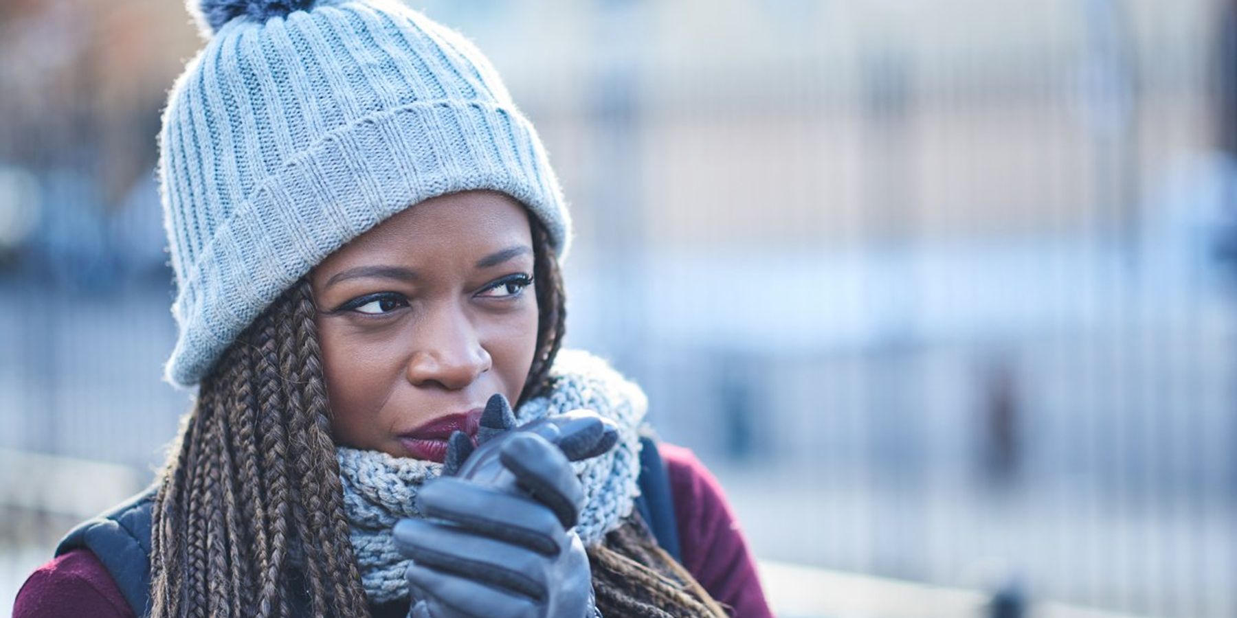 woman looking thoughtful on a wintery day outdoors