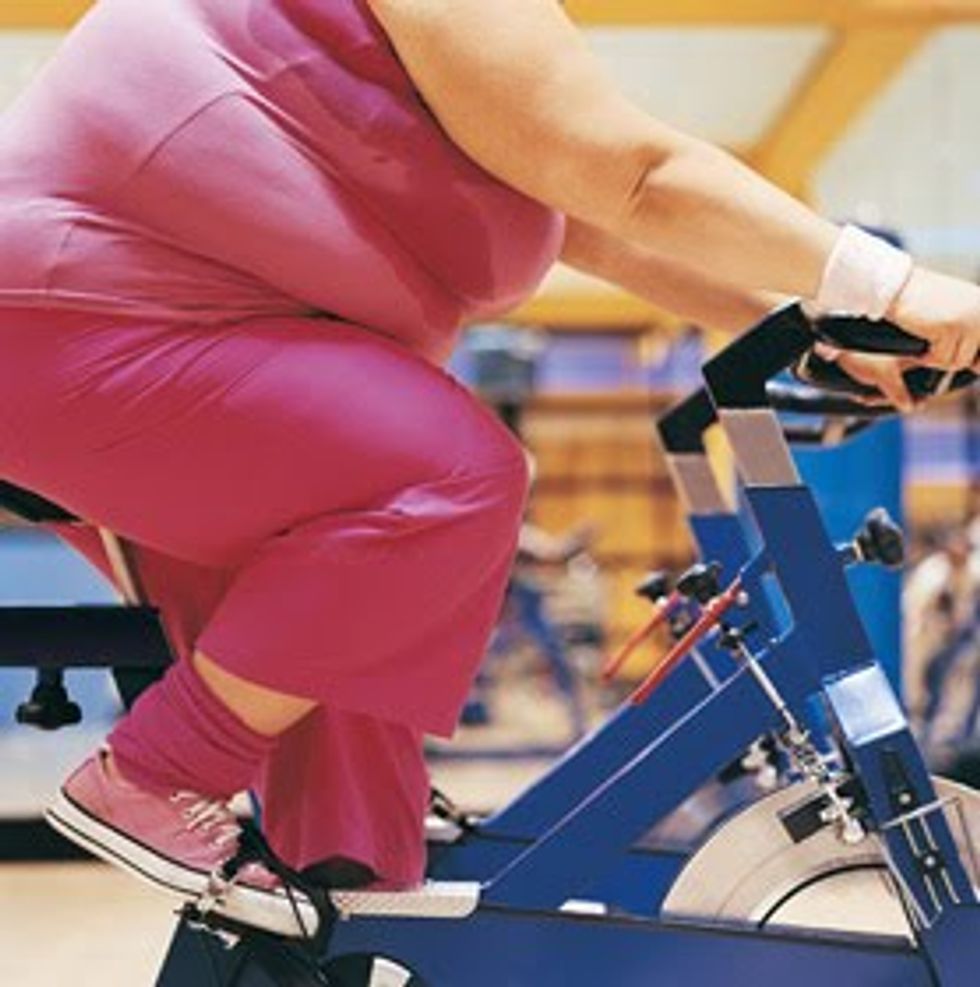 woman on a stationery bike