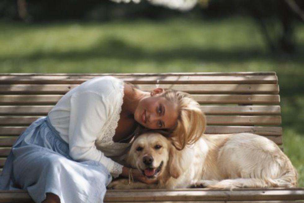 woman petting a dog