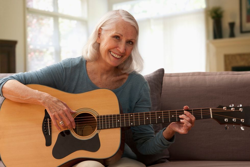 woman playing guitar