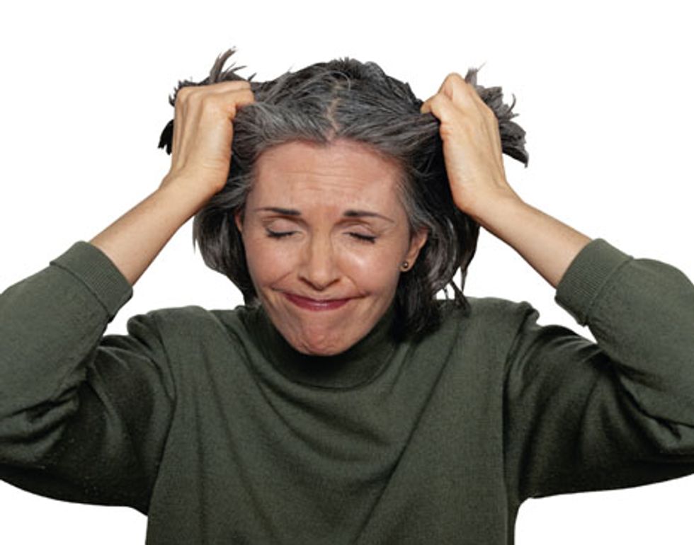 woman pulling her hair