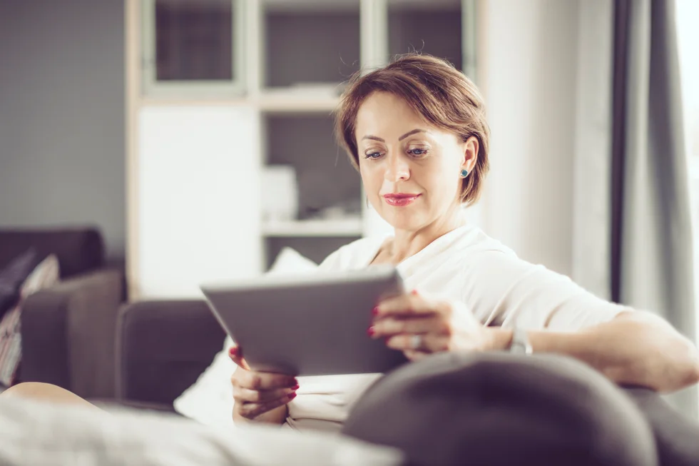 woman reading on a tablet