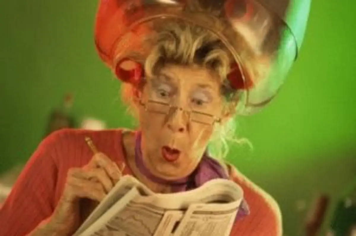 woman reading the newspaper