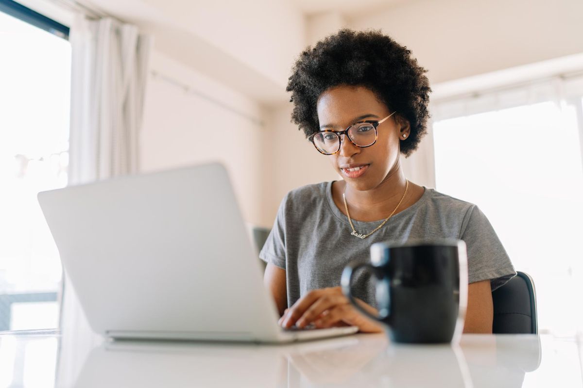 woman researching on her laptop