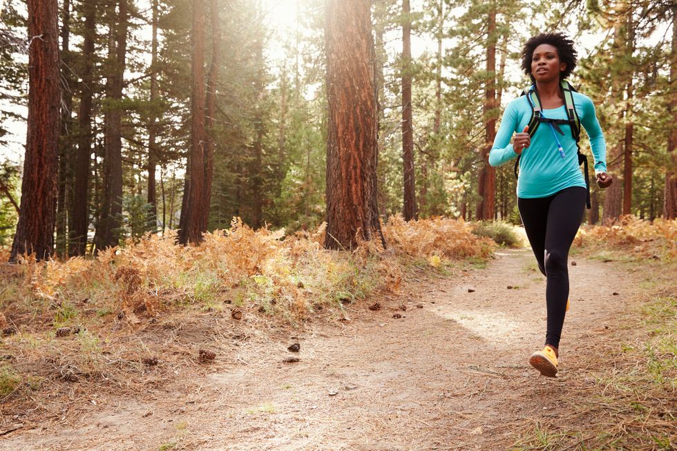 woman running in a forest