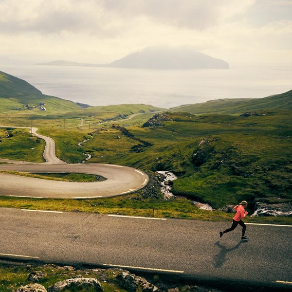 woman running on a winding road