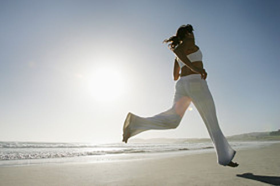 woman running on the beach