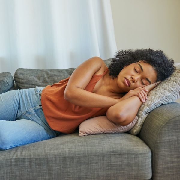 woman sleeping on a sofa at home
