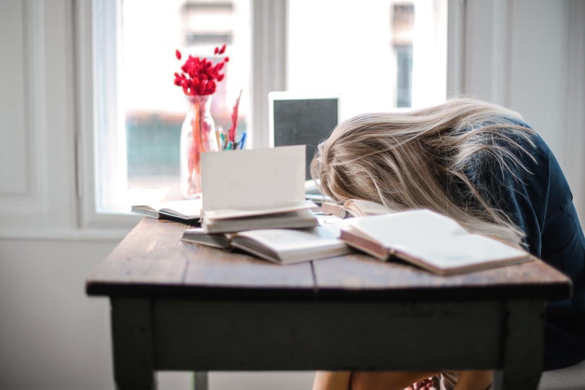 woman sleeping on her desk
