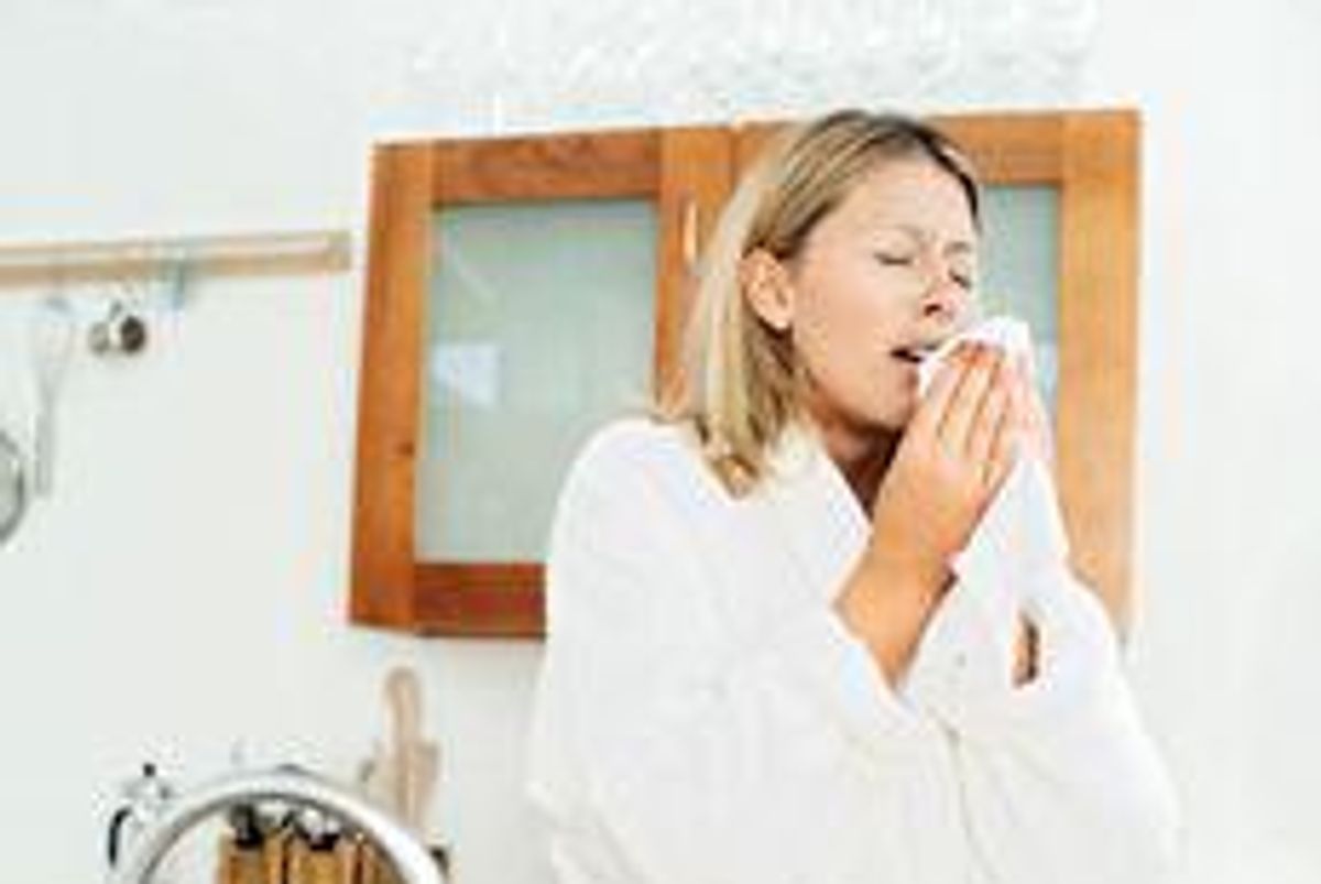 woman sneezing