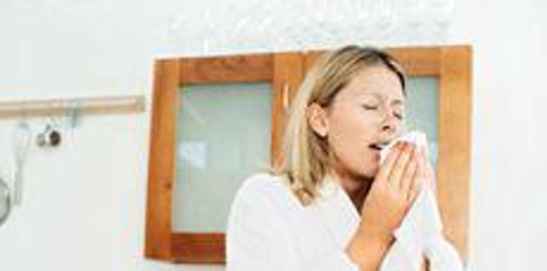 woman sneezing