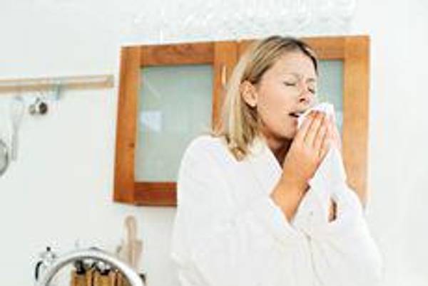 woman sneezing