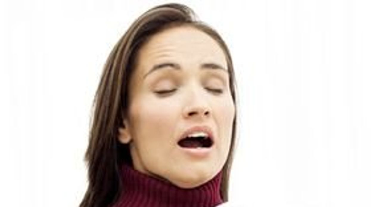 woman sneezing