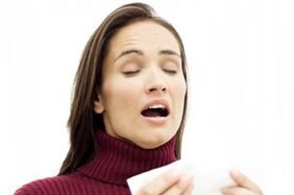 woman sneezing