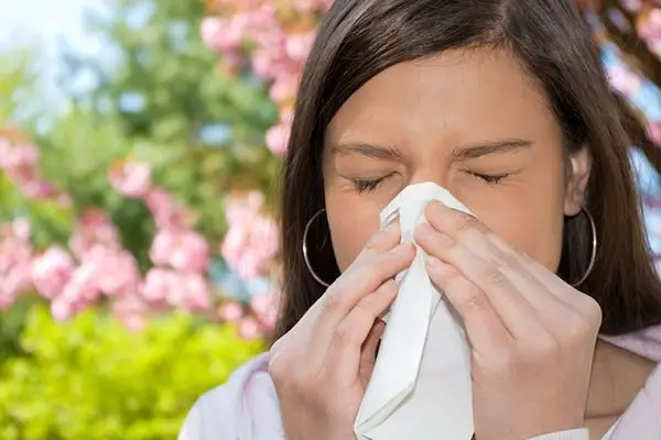 woman sneezing