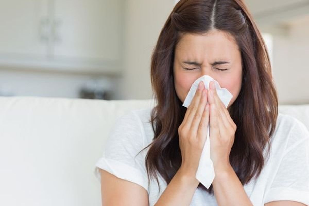 woman sneezing