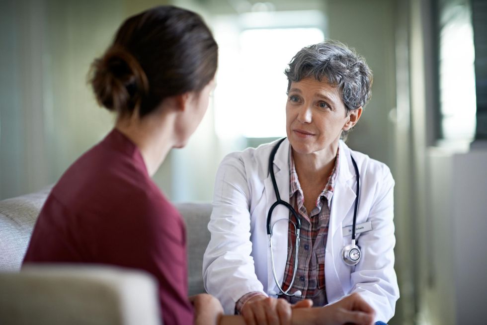 woman speaking with her doctor