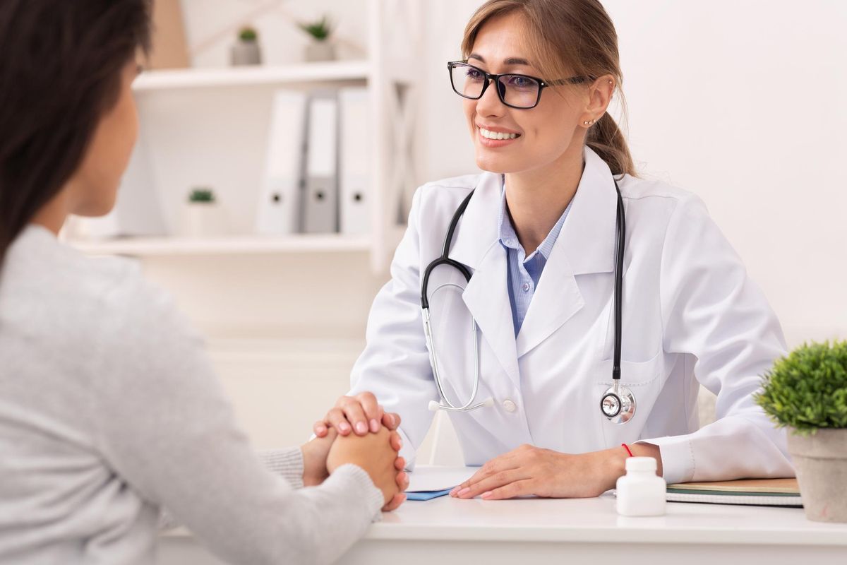 woman speaking with her doctor