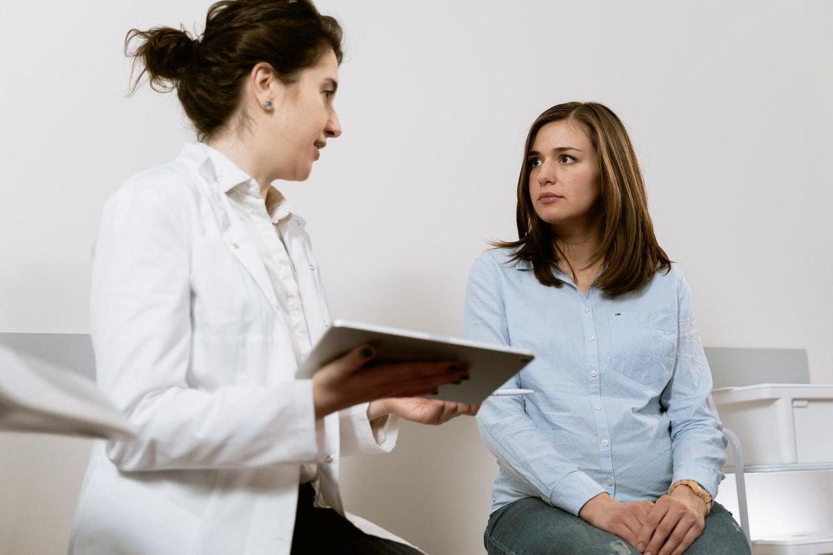 woman speaking with her doctor