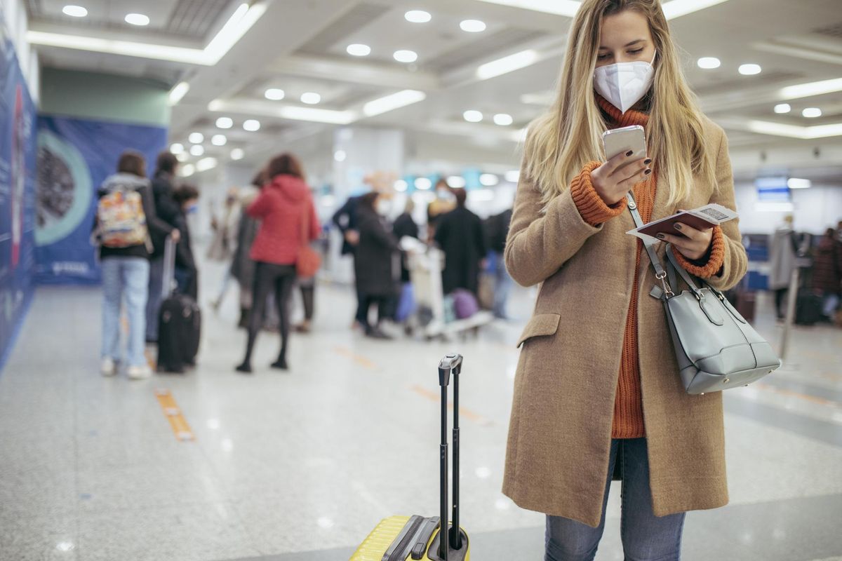 woman standing in the airpott