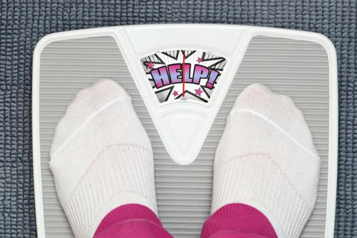 woman standing on a scale