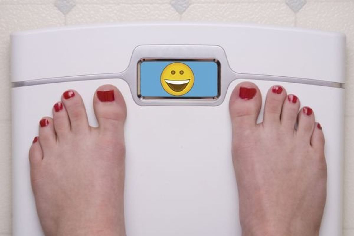 woman standing on a scale